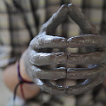 hands covered in clay