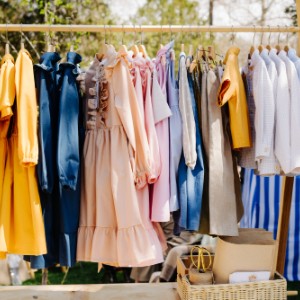 hanging clothes at a garage sale